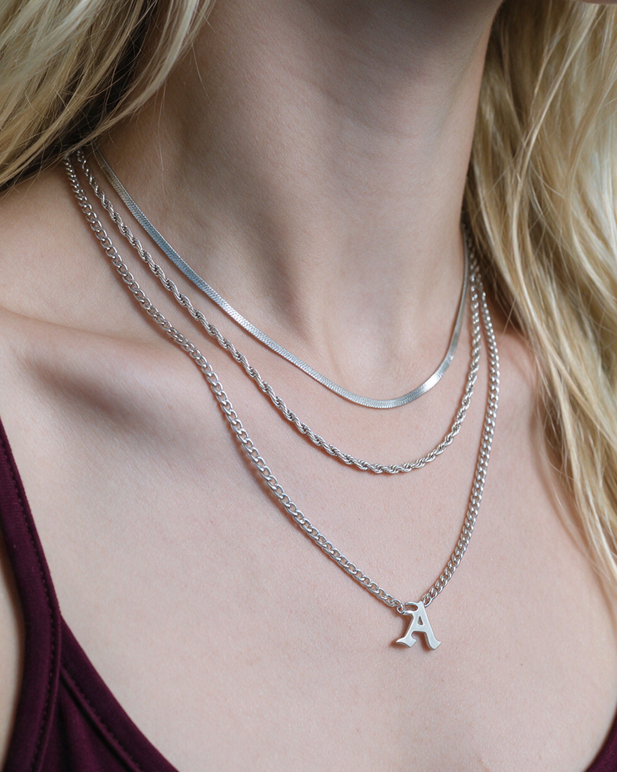 Initial Layer Set in silver, worn by a model