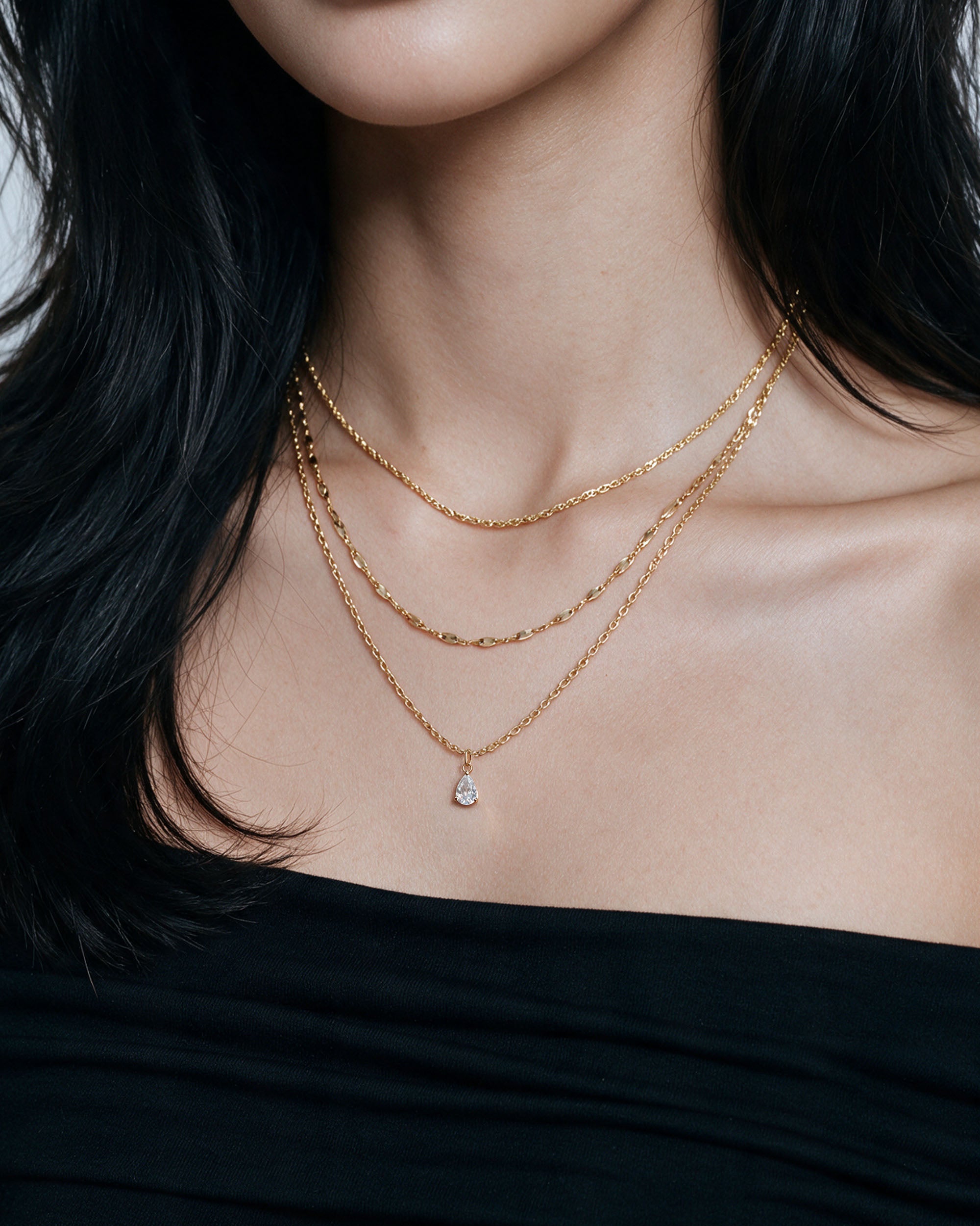 Pear Drop Necklace Set in gold, worn by a model