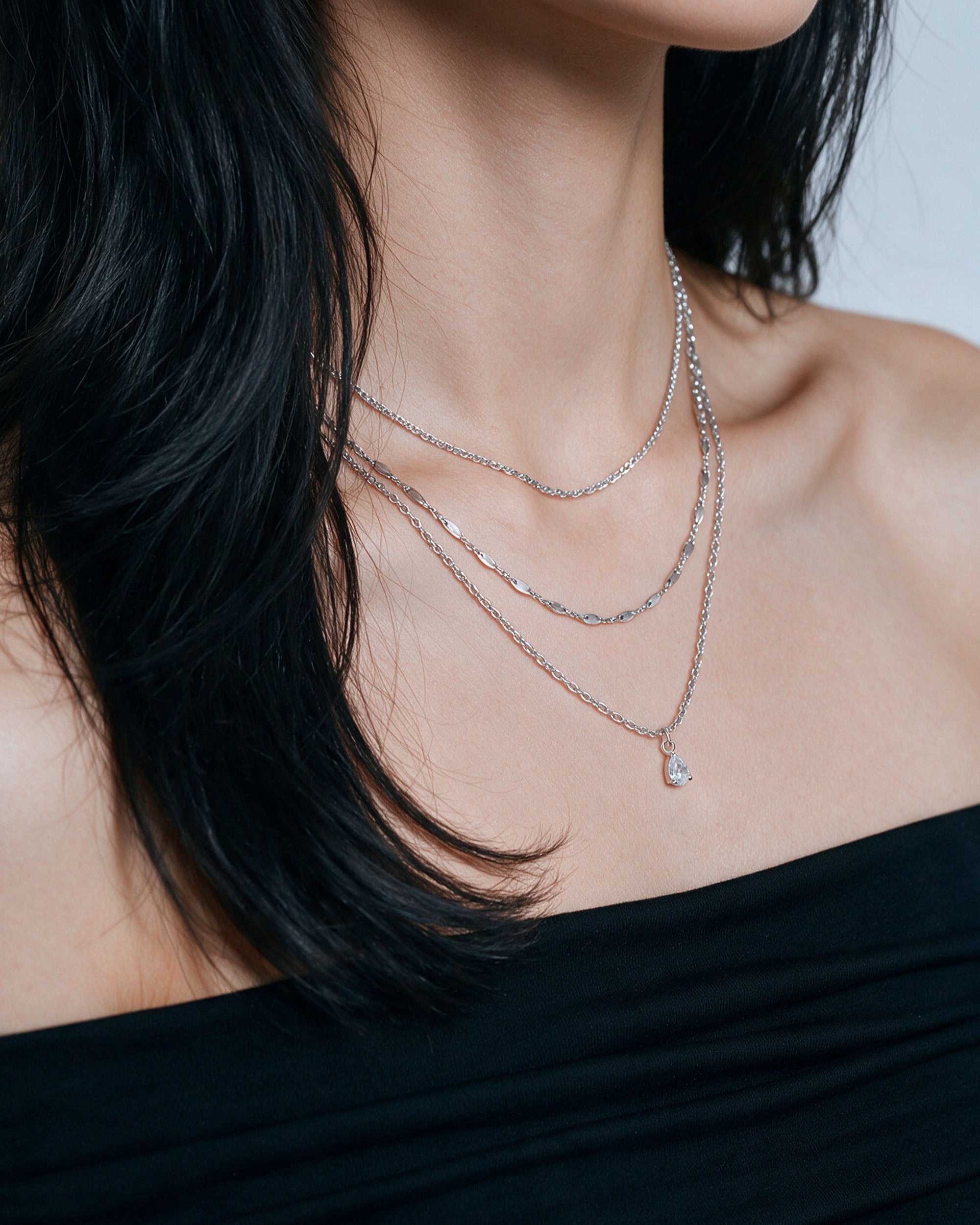 Pear Drop Necklace Set in silver, worn by a model