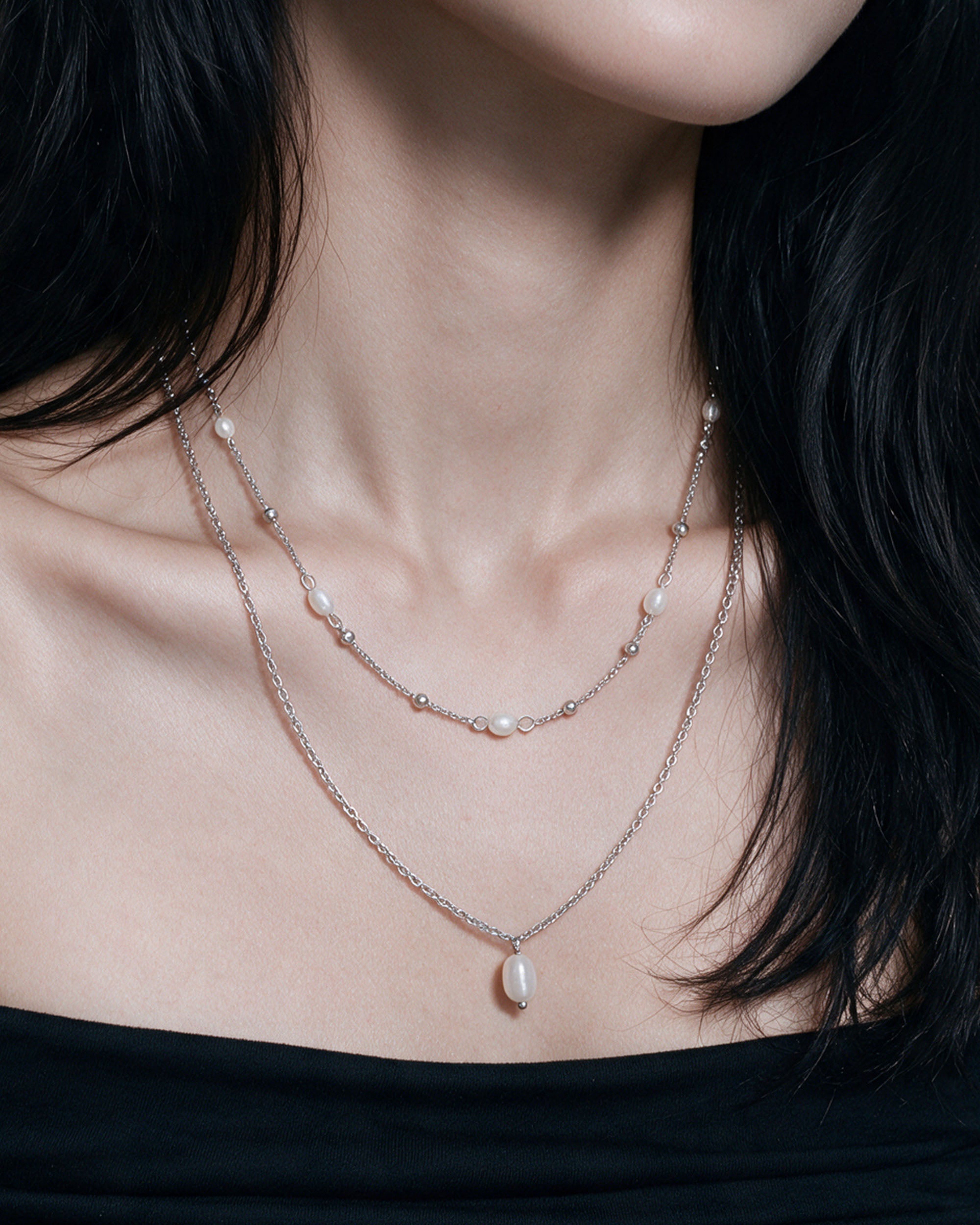 Pearl Duo Necklace Set in silver, worn by a model