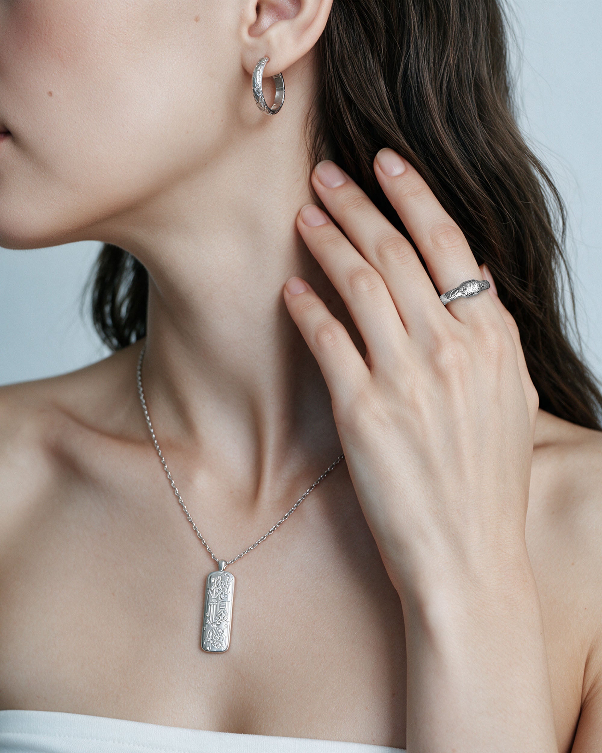 Plum Blossom Set in silver, worn by a model