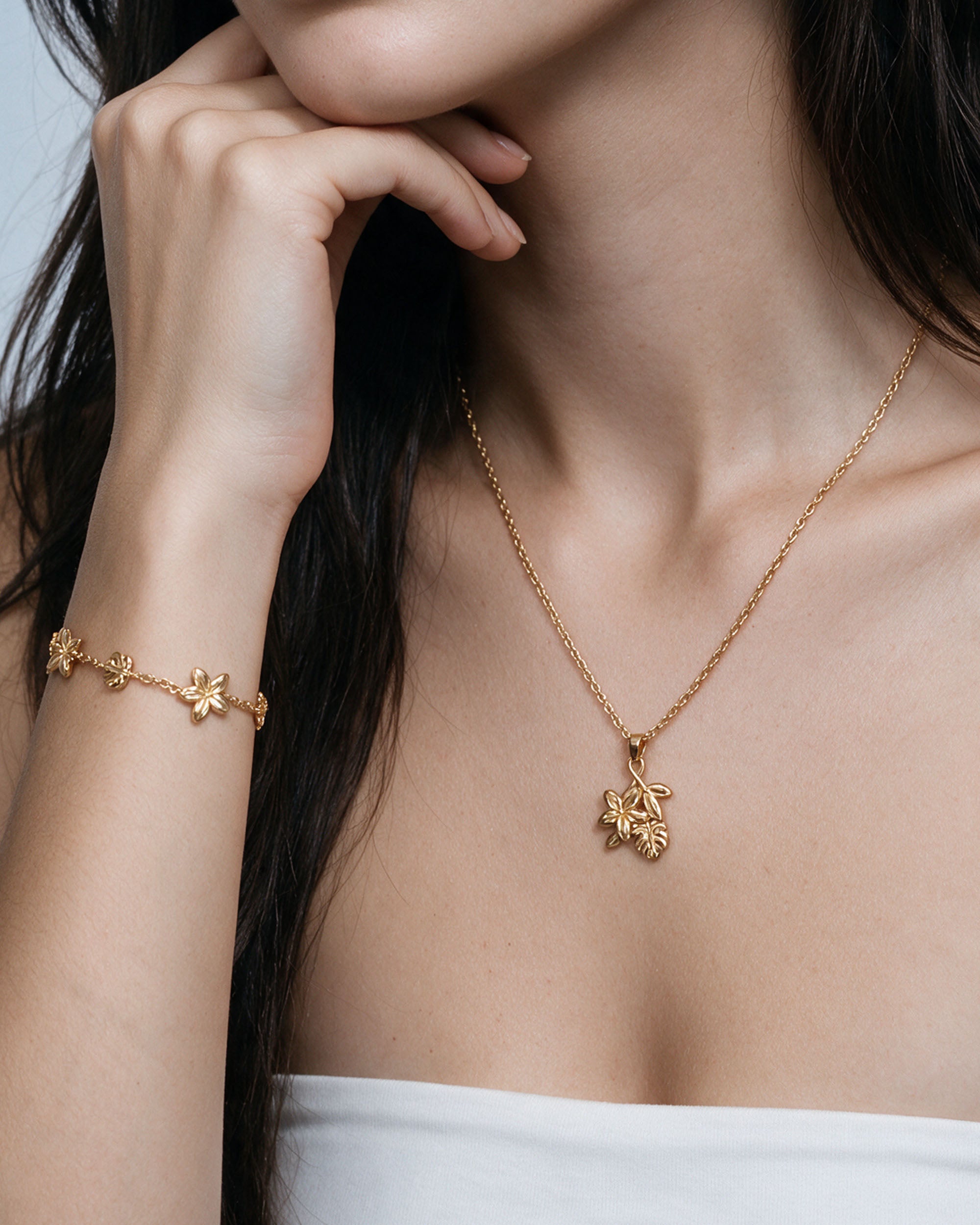 Plumeria Monstera Set in gold, worn by a model