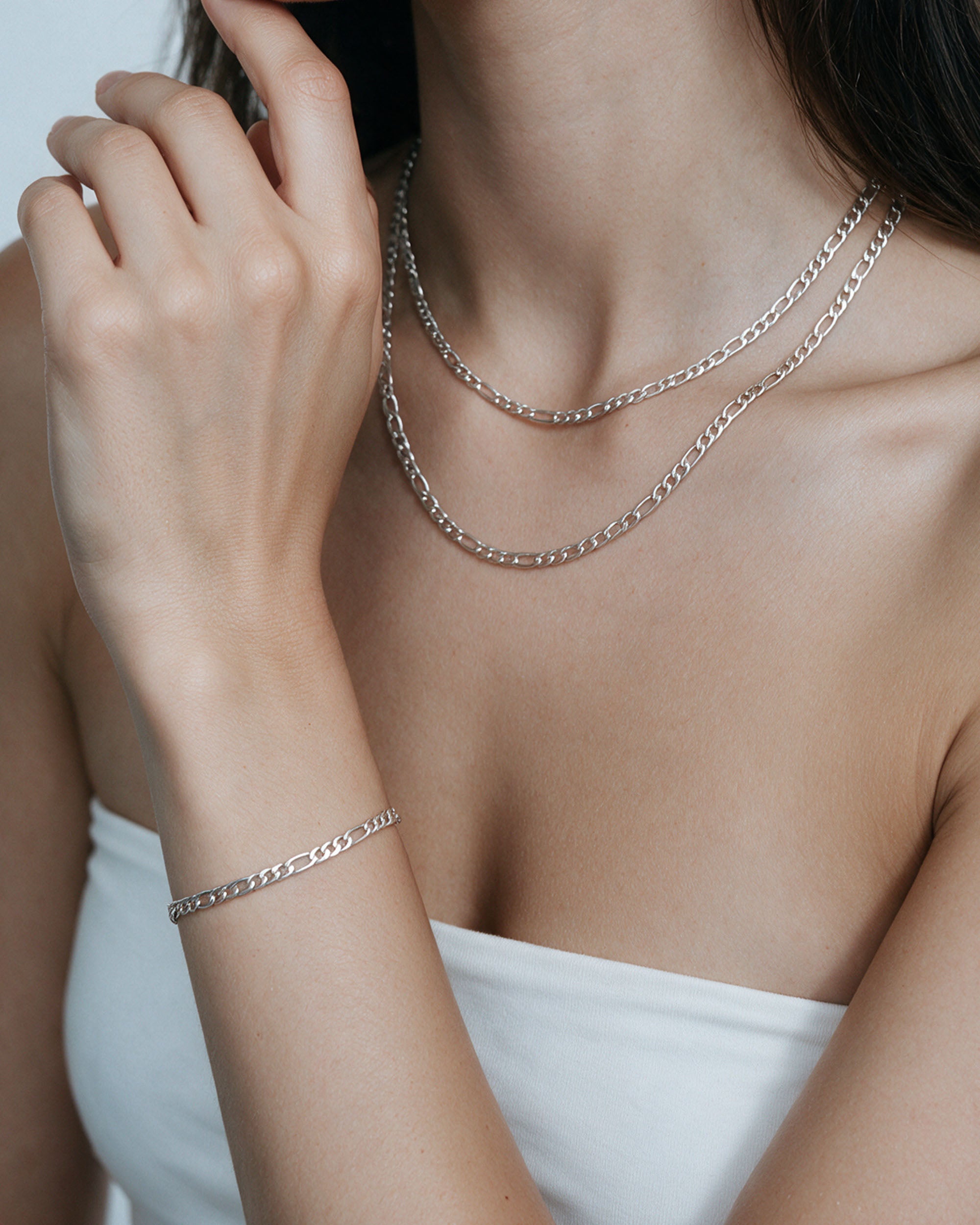 The Figaro Set in silver, worn by a model