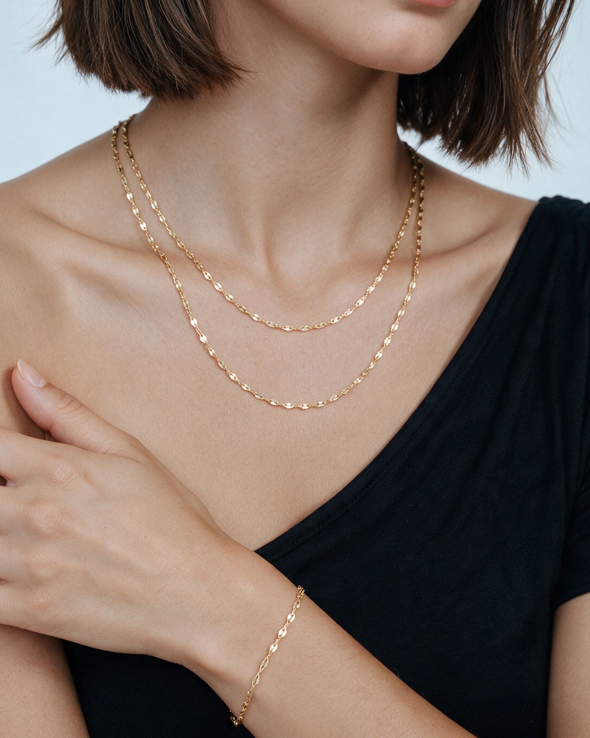 The Kara Set in gold, worn by a model