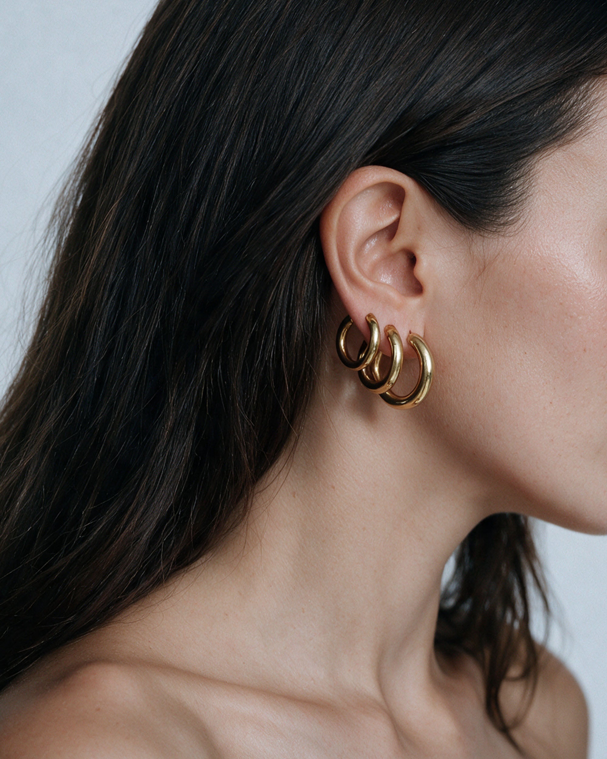 Triple Chunky Endless Hoops in gold, worn by a model