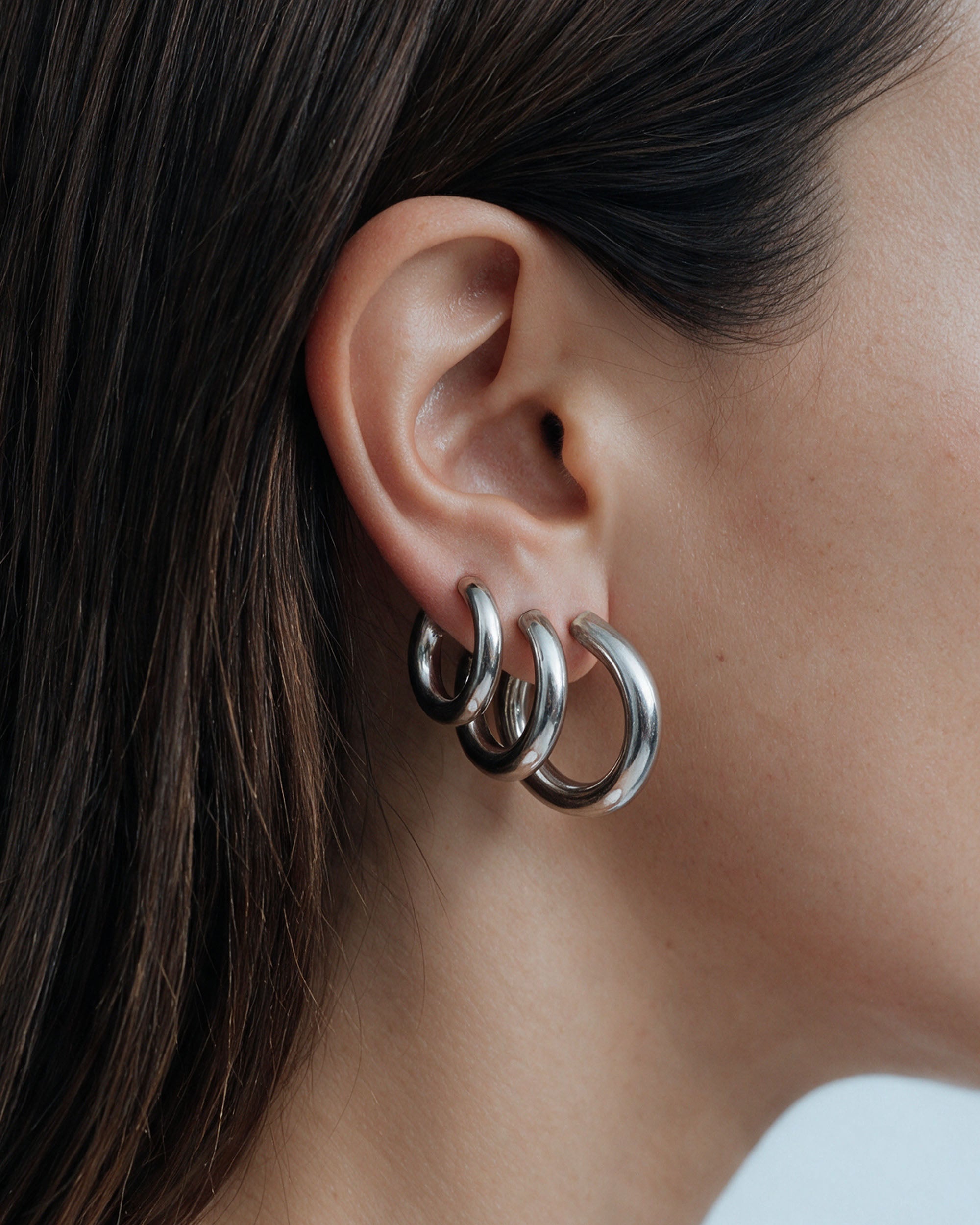 Triple Chunky Endless Hoops in silver, worn by a model