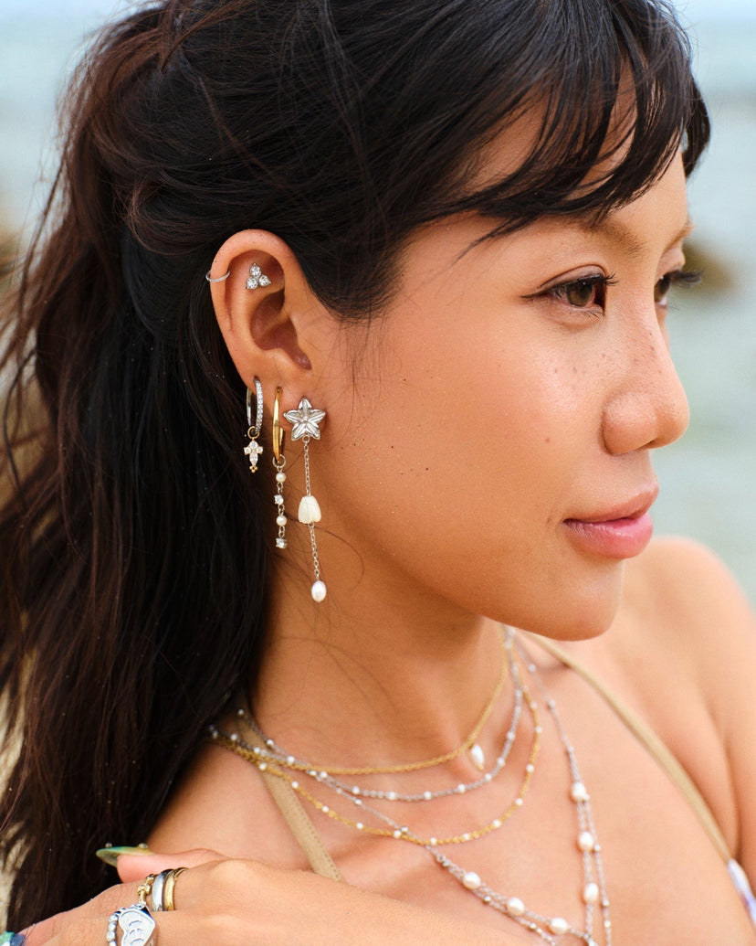 Earring stack with Pikake Bloom pearl earring on model