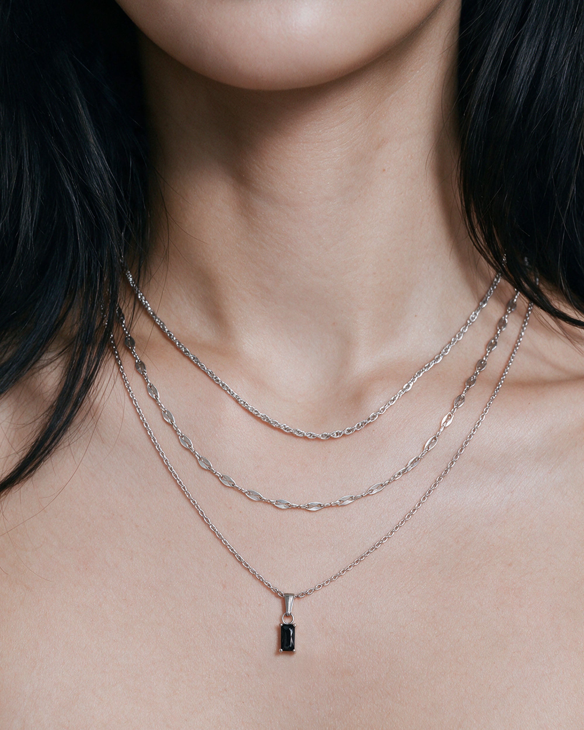 
Emerald Cut Necklace Set — Black in silver, worn by a model