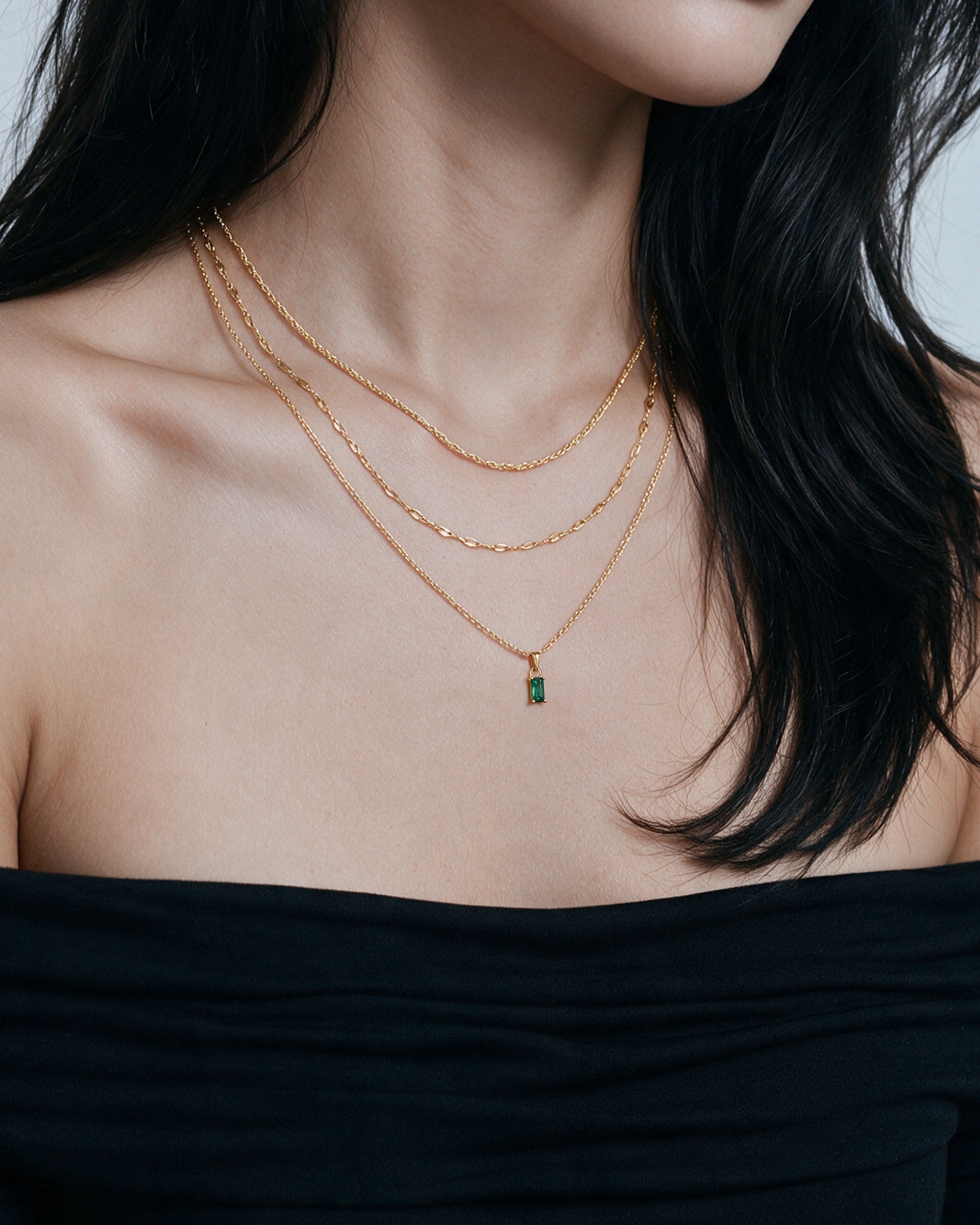 
Emerald Cut Necklace Set — Green in gold, worn by a model