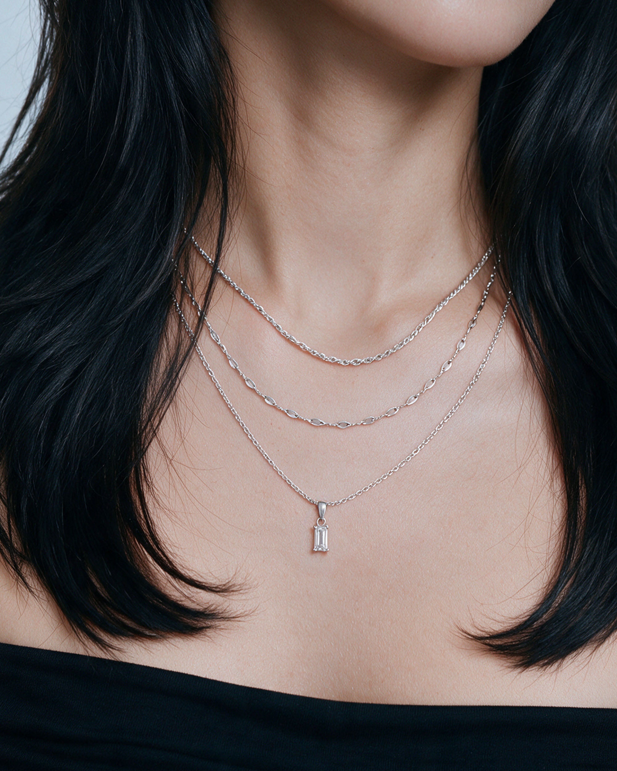 
Emerald Cut Necklace Set — White in silver, worn by a model