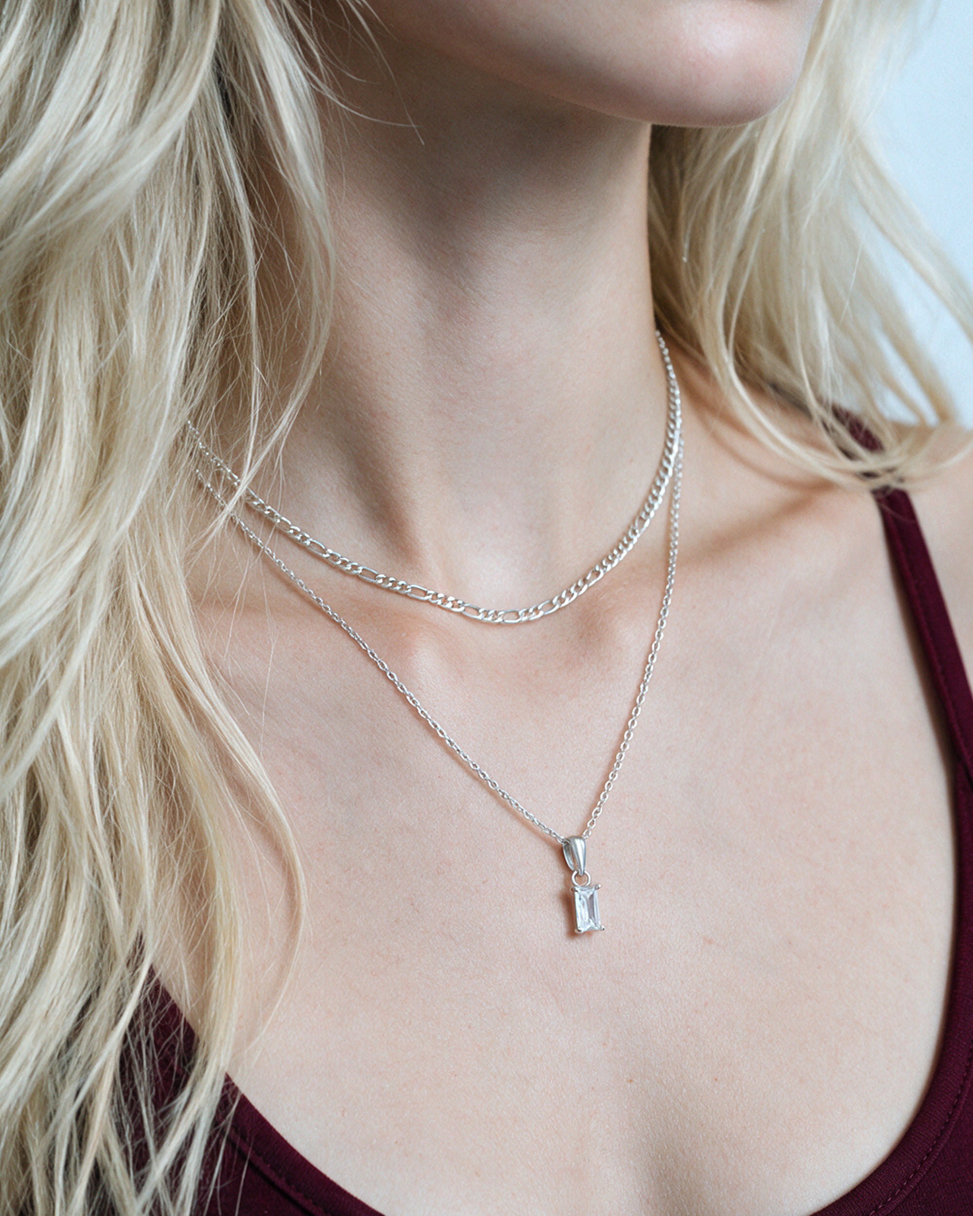 
Figaro Emerald Duo in silver, worn by a model