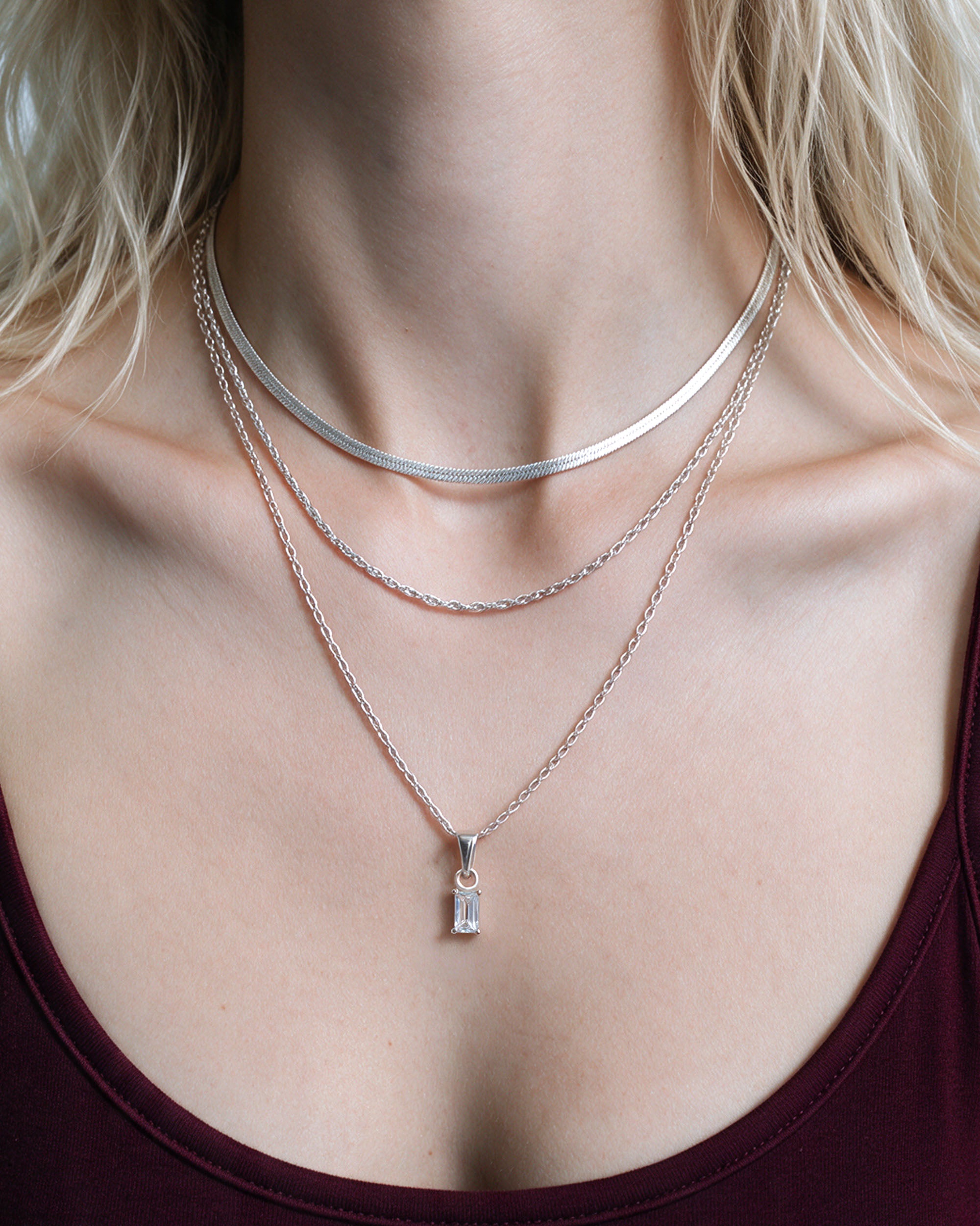 
Herringbone Emerald Set in silver, worn by a model