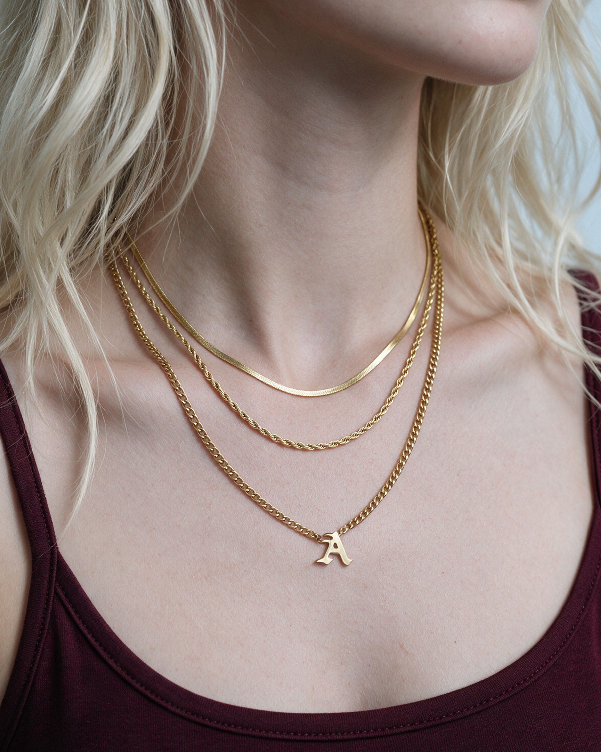
Initial Layer Set in gold, worn by a model