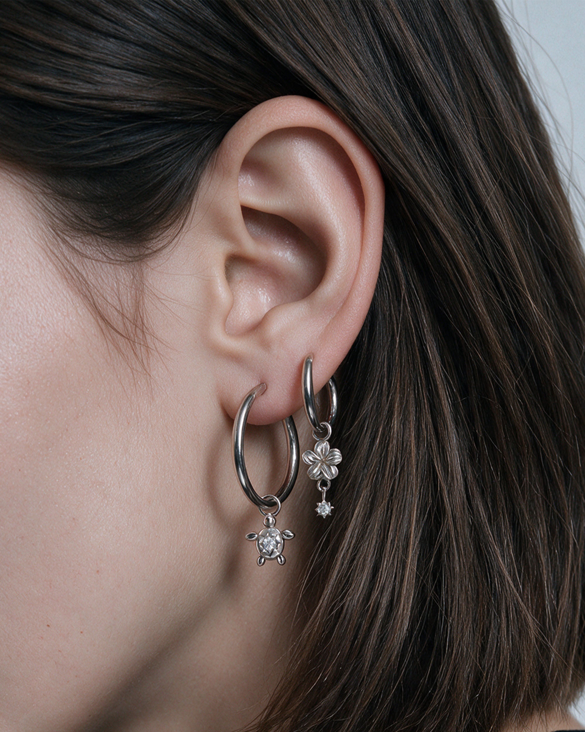 
Island Charm Hoop Set in silver, worn by a model