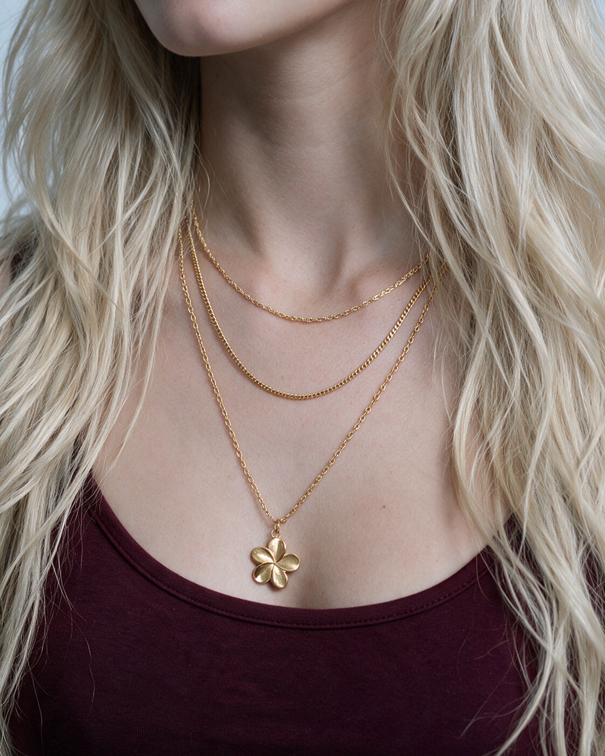 
Island Plumeria Layer Set in gold, worn by a model