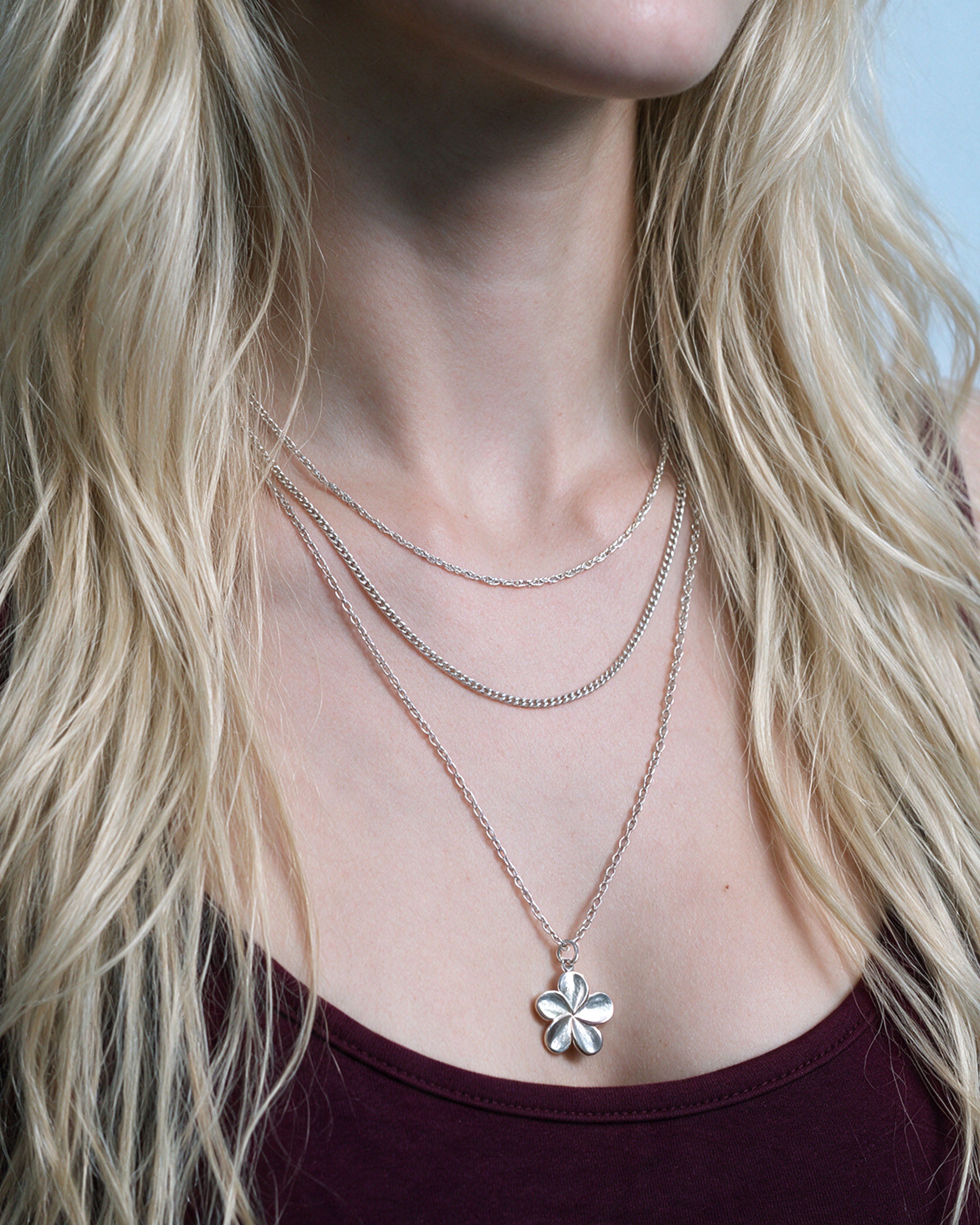 
Island Plumeria Layer Set in silver, worn by a model