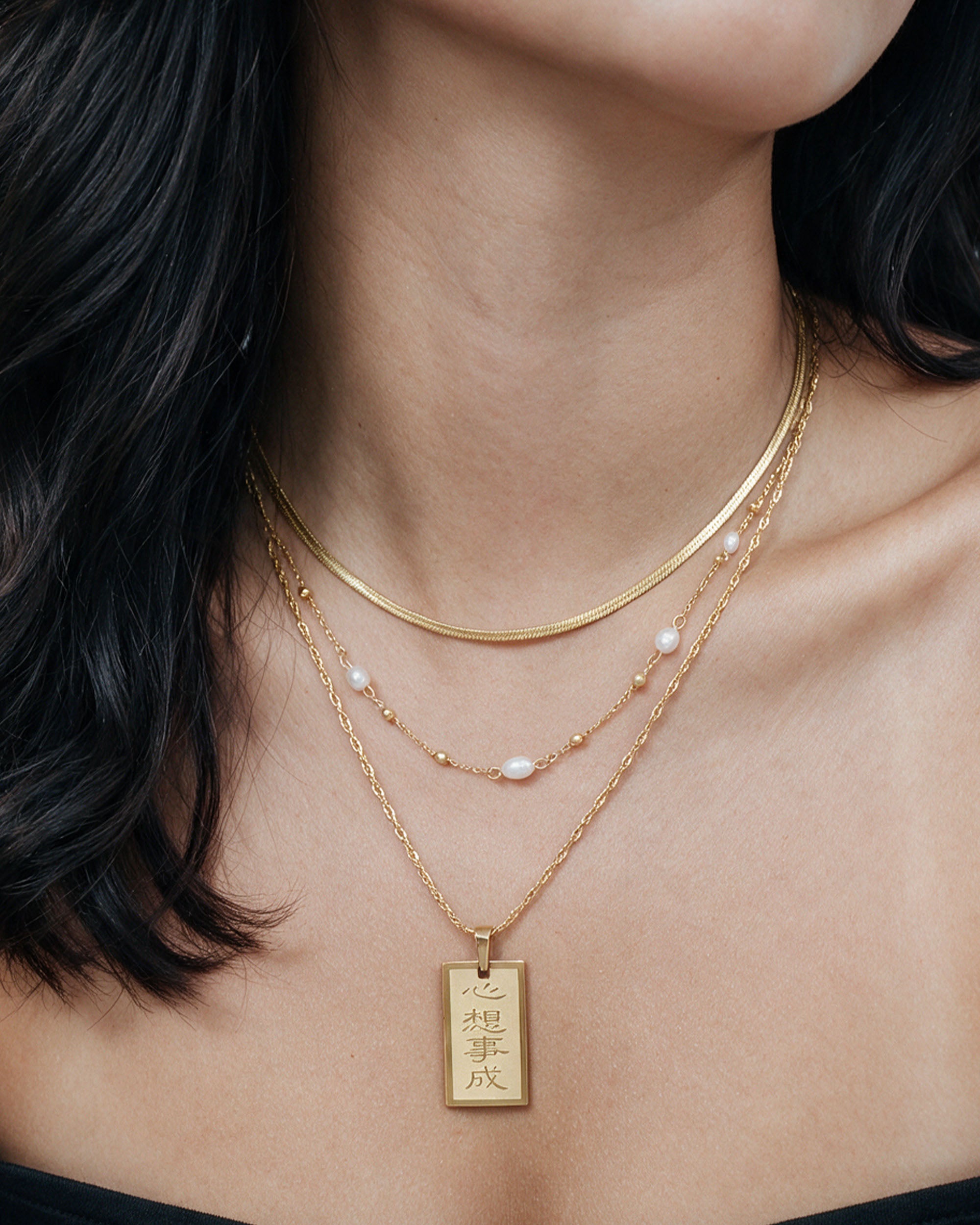 
Manifestation Layer Set in gold, worn by a model