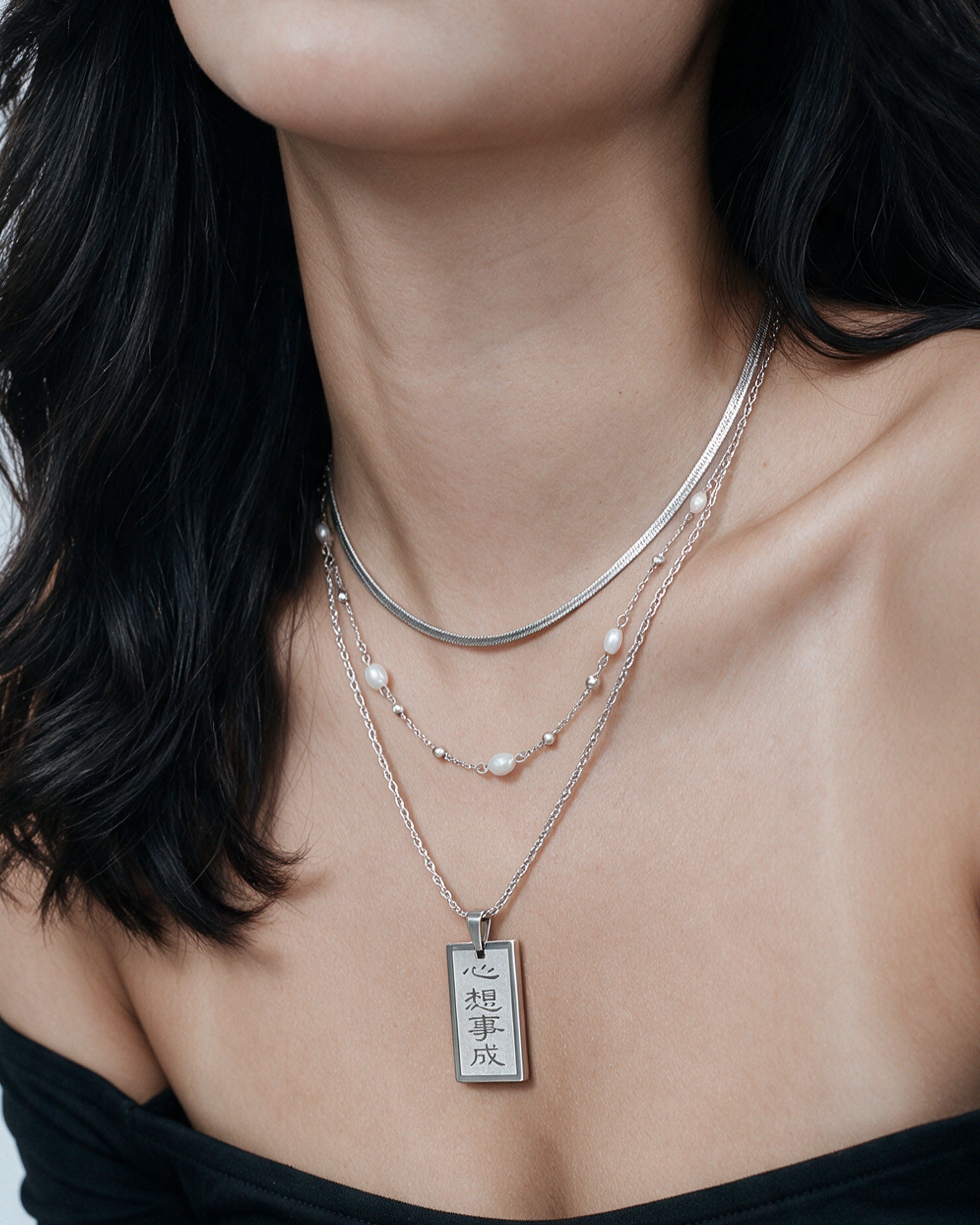 
Manifestation Layer Set in silver, worn by a model
