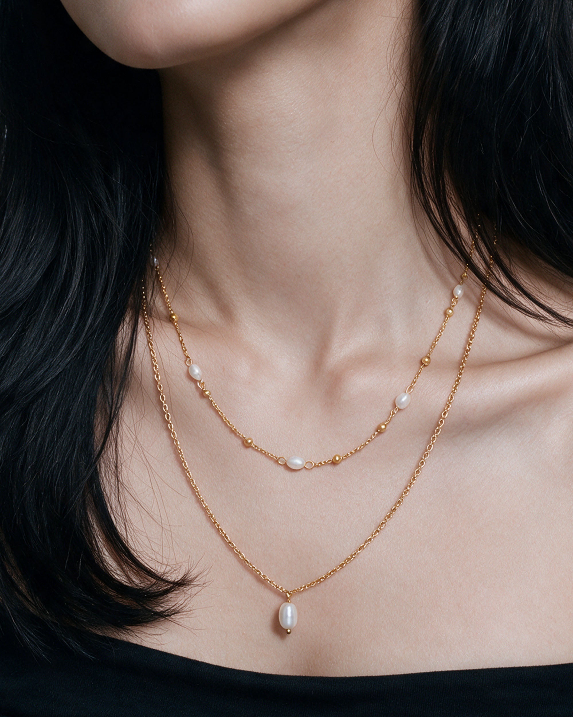 
Pearl Duo Necklace Set in gold, worn by a model