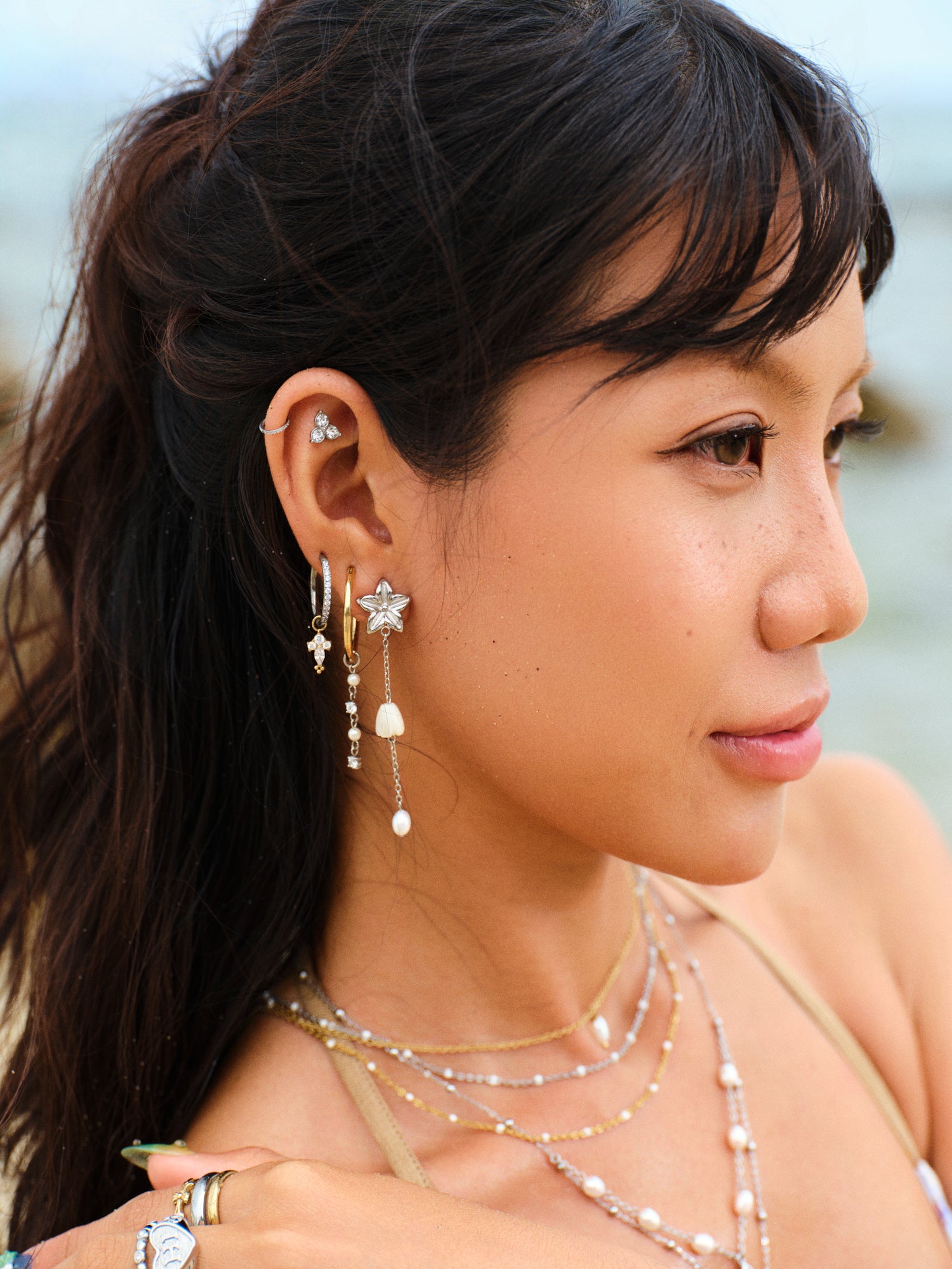 Pikake Bloom freshwater pearl earrings with pikake flower stud and cascading mother of pearl chains