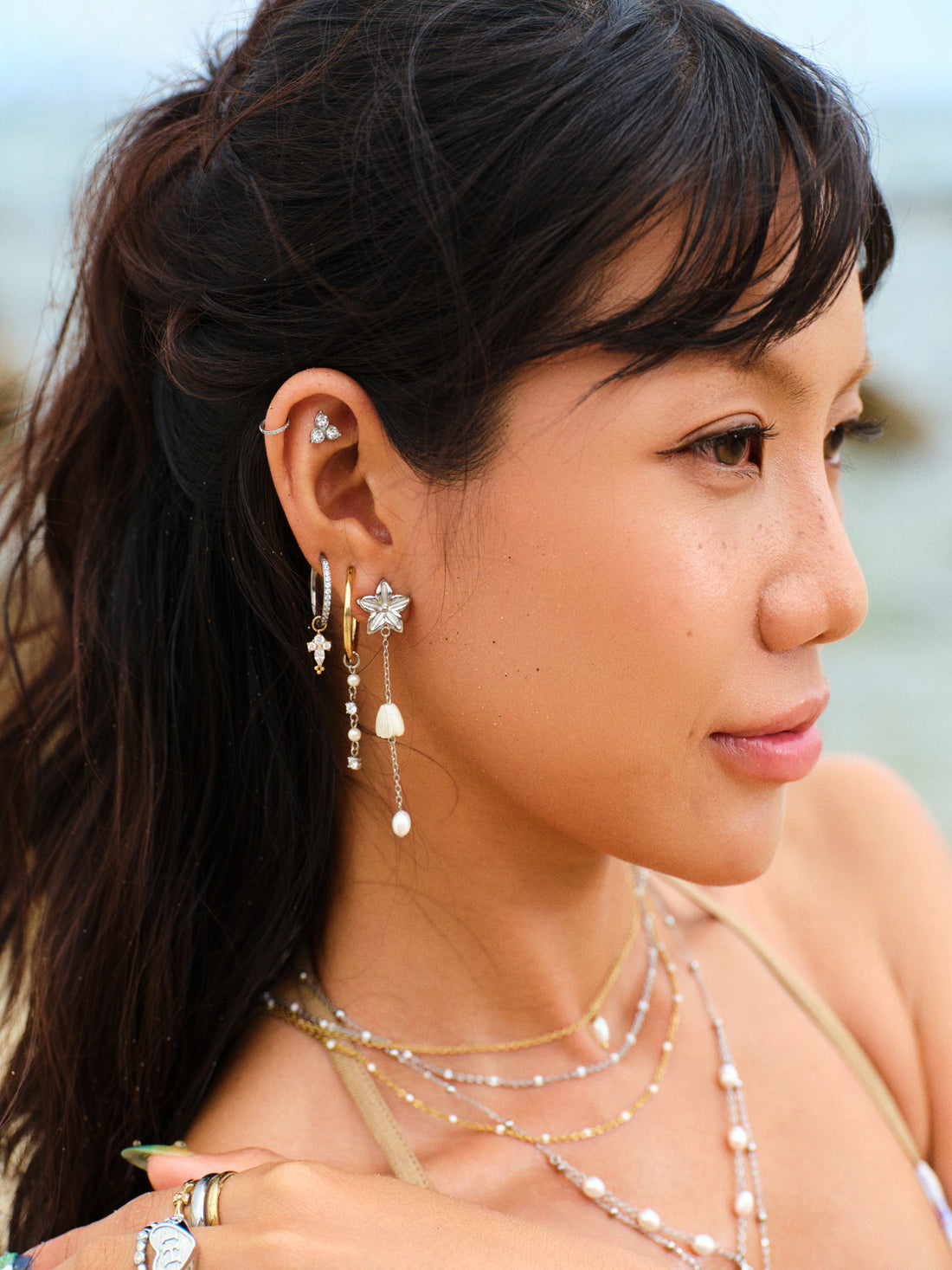 
Pikake Bloom freshwater pearl earrings with pikake flower stud and cascading mother of pearl chains