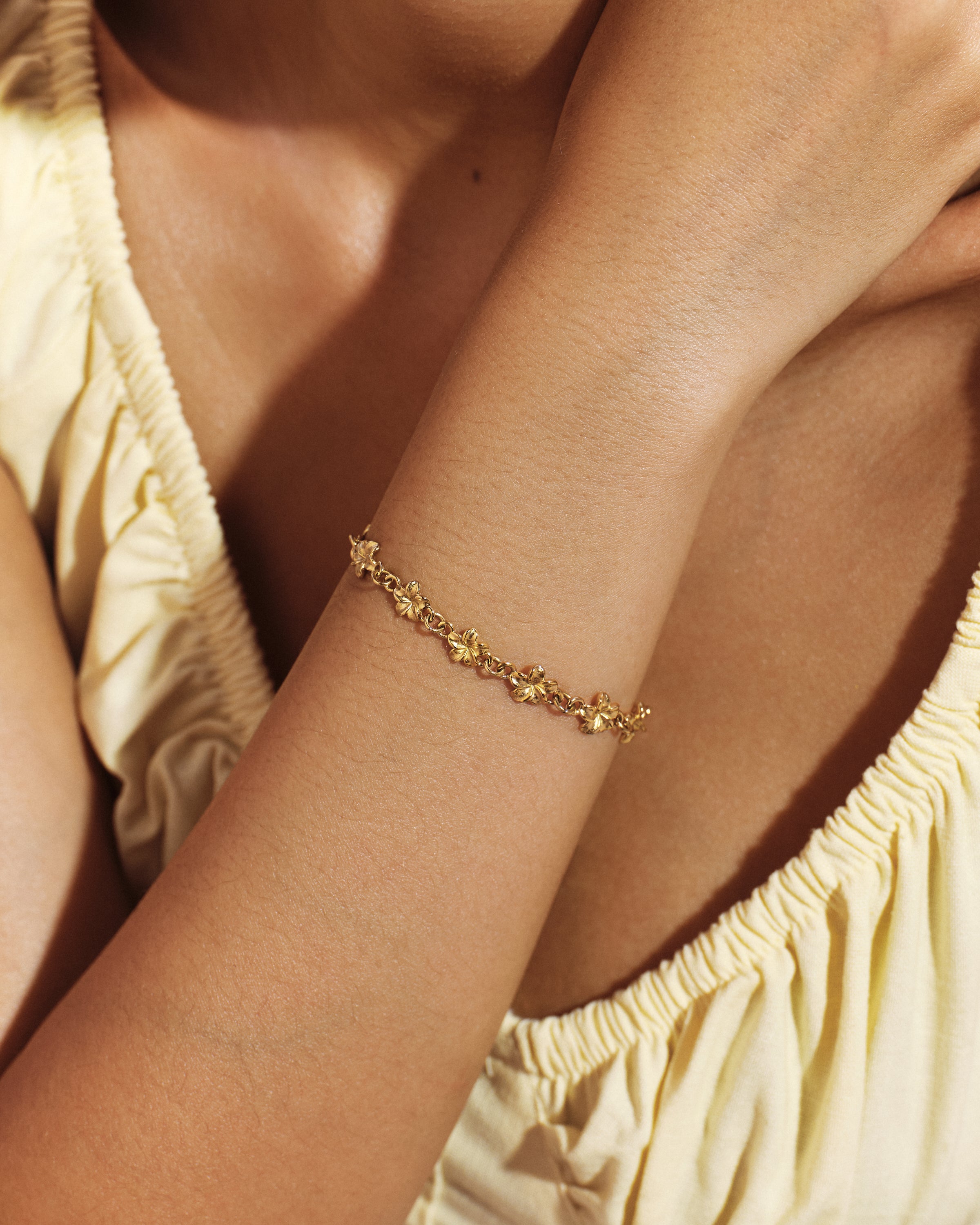 
Model wearing the Plumeria Bloom Cluster Bracelet