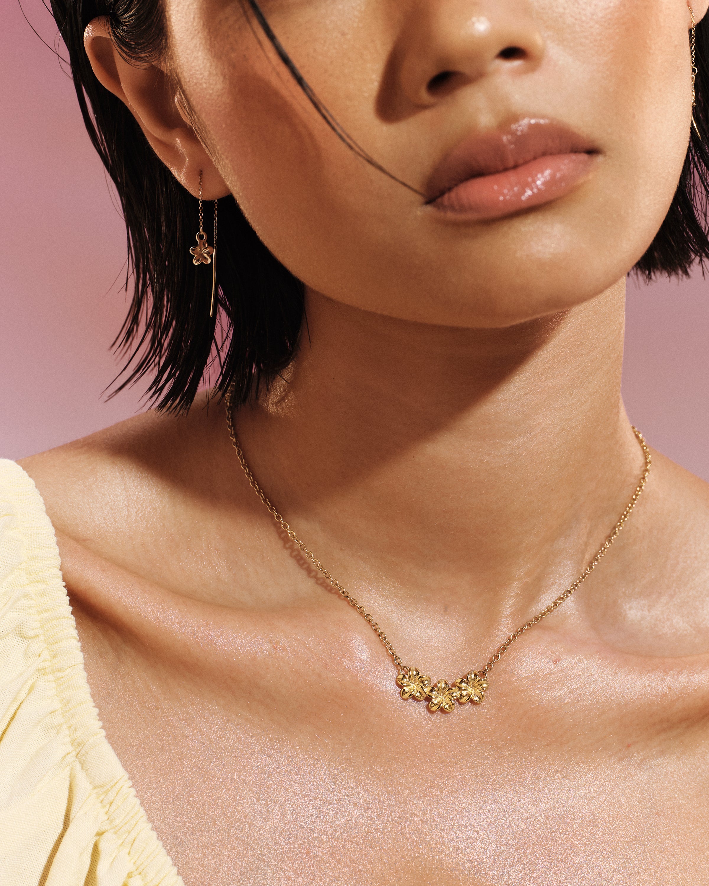
Model wearing the Plumeria Bloom Collar Necklace