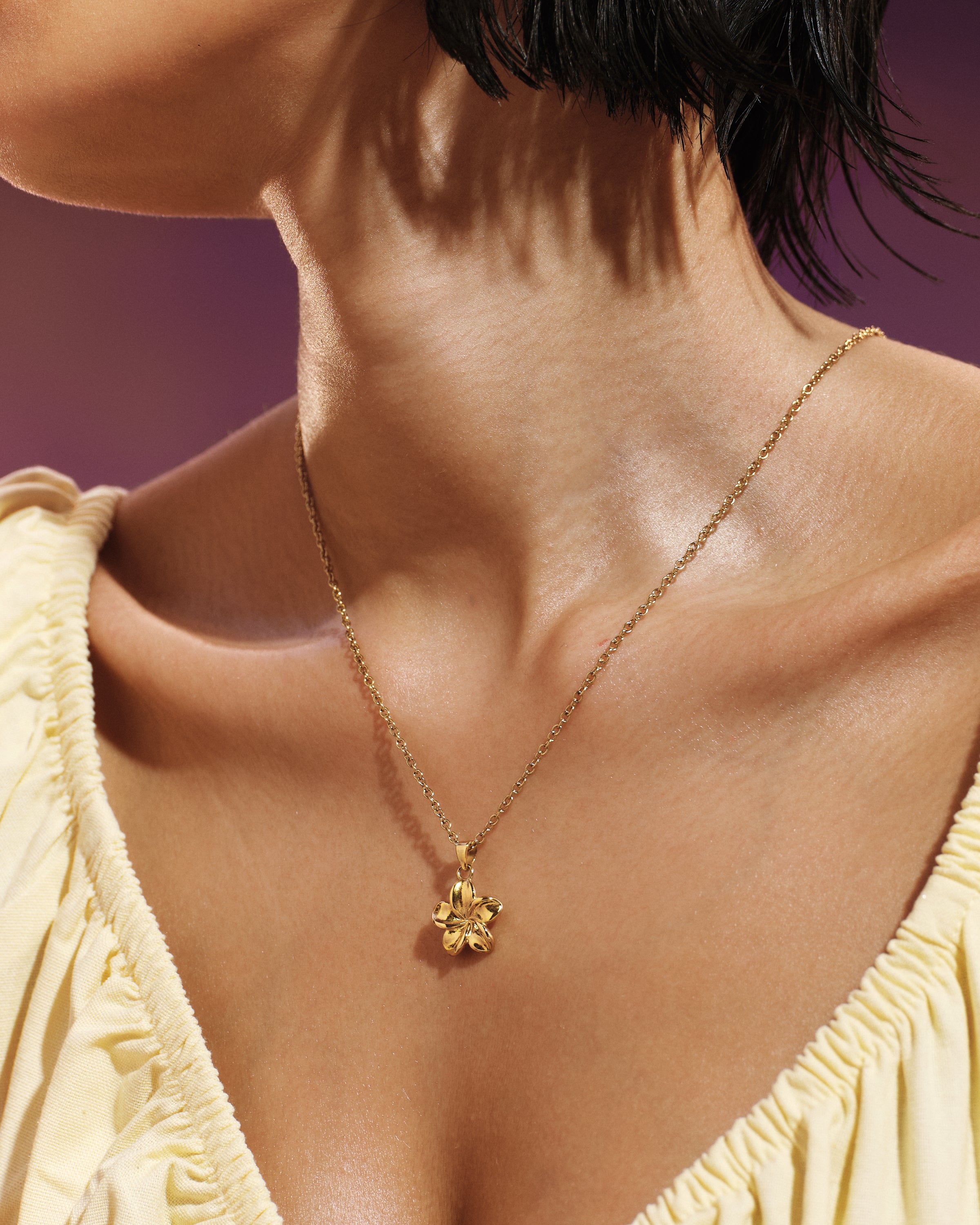 
Model wearing the Plumeria Bloom Necklace