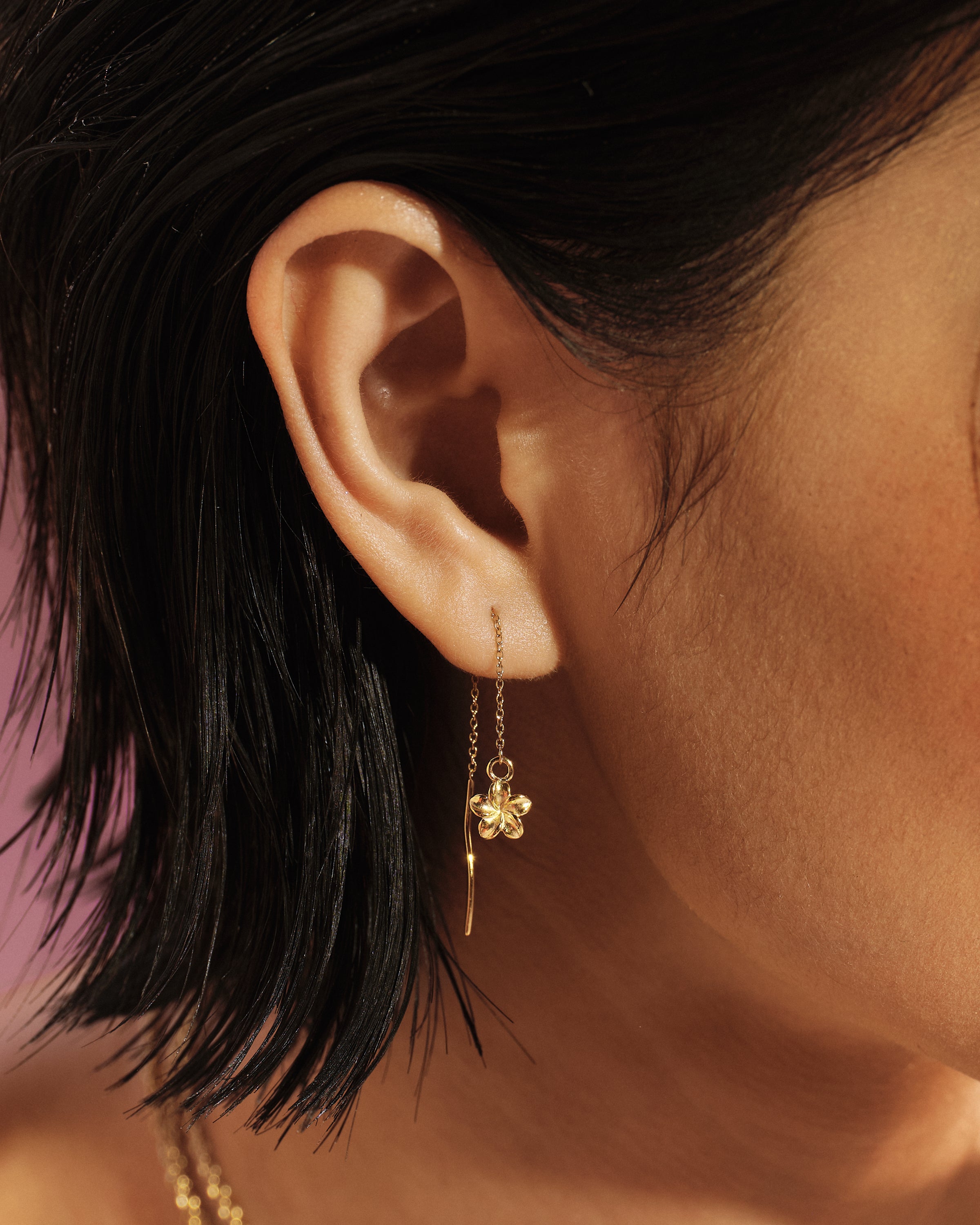 
Model wearing the Plumeria Bloom Threader Earring