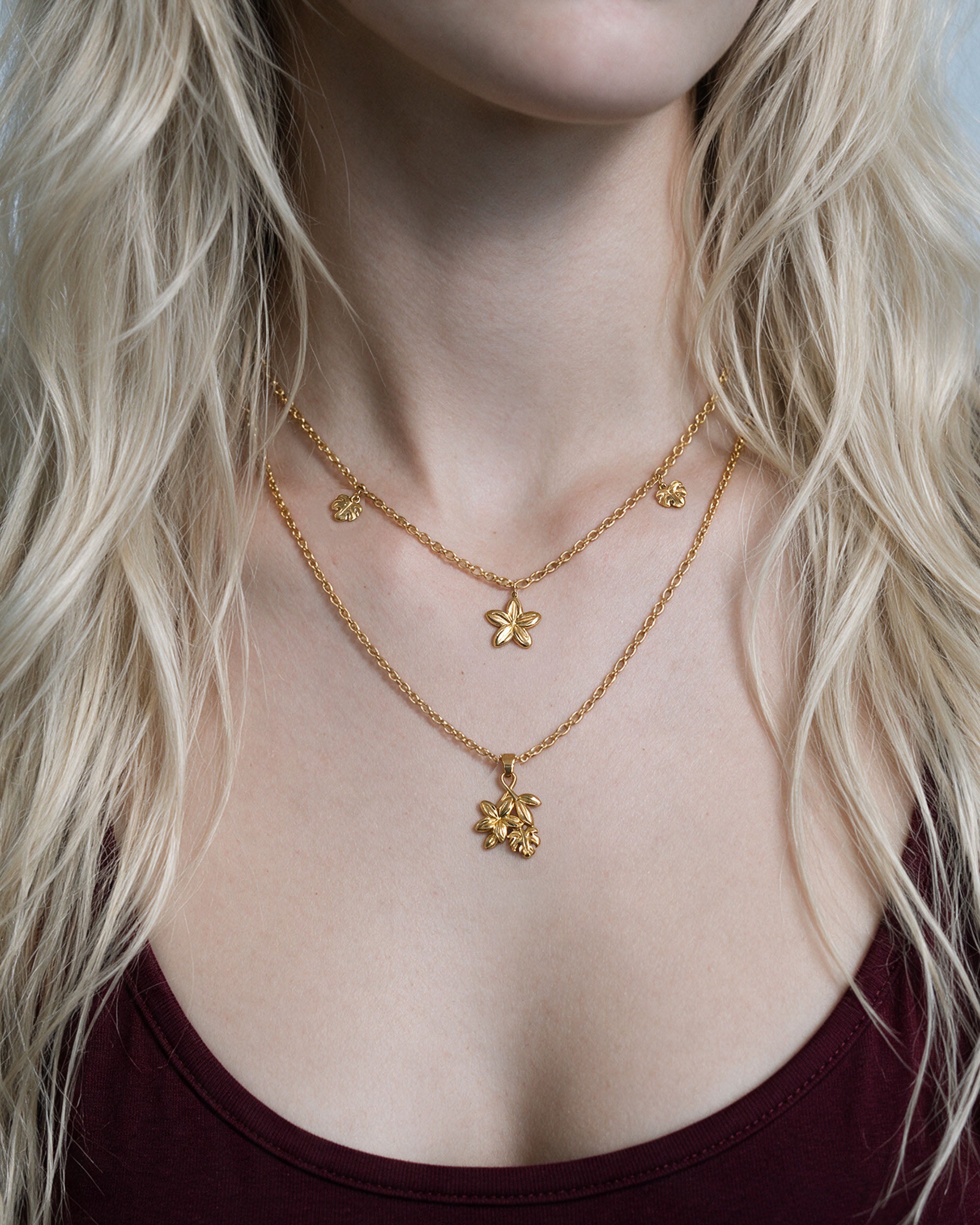 
Plumeria Monstera Layer Set in gold, worn by a model